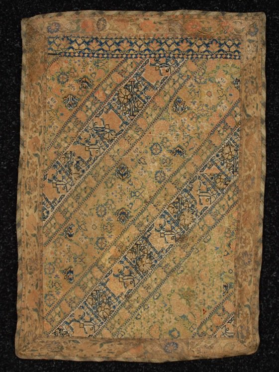 SAFAVID PANEL, 17th - 18th C.: Embroidery probably from a woman's trouser leg, silk in green, red, blue and white in a diagonal design of dense flowers. 20 x 15. (Some staining, later border) very good.