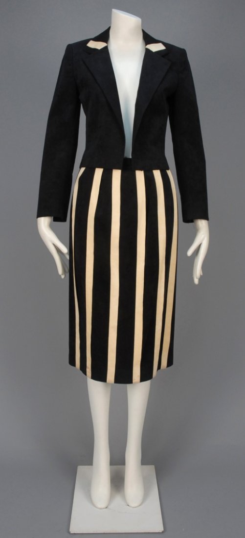VERA MAXWELL ULTRASUEDE SUIT with TWO SKIRTS, 1970s.: Black jacket with notched collar having cream band detail, long and short narrow skirts with appliqued cream stripes and back slit, long skirt having unstitched stripes at deep hem creating fringe. La