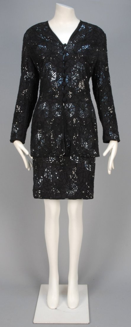 ESCADA SPIDER WEB SKIRT SUIT, 1980s.: Black silk chiffon having allover spider web pattern in black beads and sequins, long collarless jacket with self button & loop closures, matching pencil skirt with satin waistband. Labeled. B-38, jac