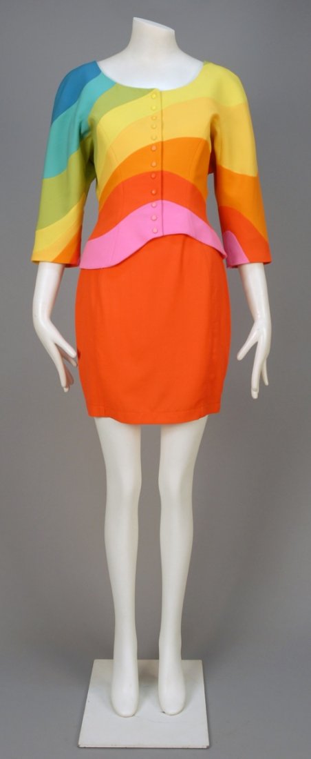 THIERRY MUGLER RAINBOW SKIRT SUIT, 1980s.: Snap front boatneck jacket with 3/4 raglan sleeve, pieced in asymmetrical colored bands creating a curved hem, matching orange narrow skirt. Skirt labeled. B-36, jacket L-22, W-25, H-37, skirt L-19. (