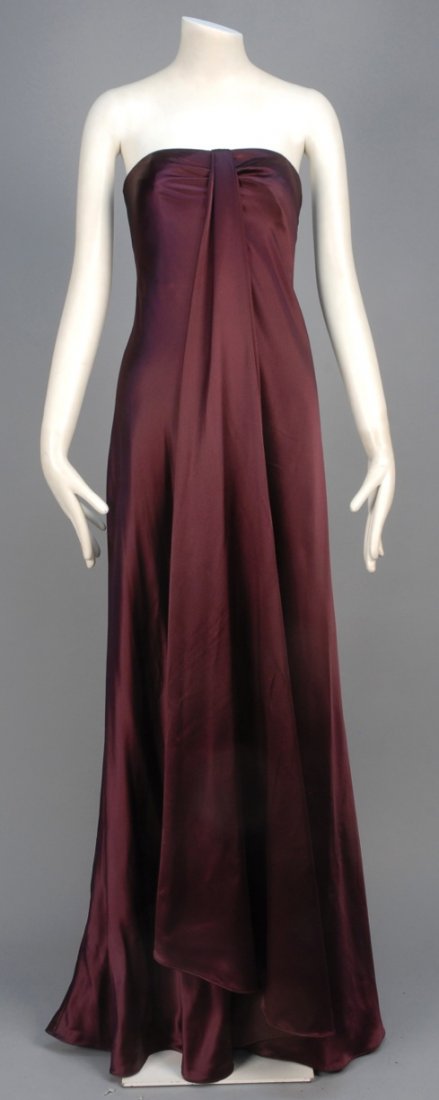 RALPH LAUREN STRAPLESS SATIN EVENING GOWN.: Aubergine silk sarong style wrap with front drapery and boned bodice. Black label. B-34, L-56. Excellent.