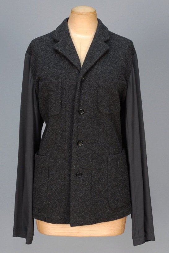 COMME des GARCONS SHIRT JACKET.: Charcoal rayon back and sleeve having knit wool blend front, collar and four patch pockets. Labeled. B-40, L-28. Excellent.