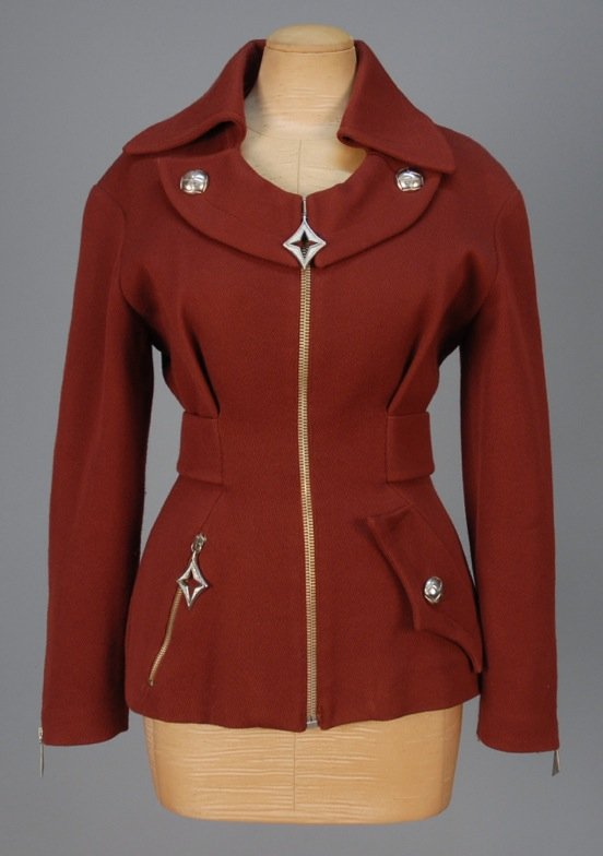 THIERRY MUGLER WOOL BLEND JACKET.: Russet ottoman with topstitched collar and rounded lapel, zip front, asymmetrical pockets, back belt and zippered sleeve. "Activ" label. B-34, W-26, L-25. (Tiny pull on one shoulder) otherwise excelle