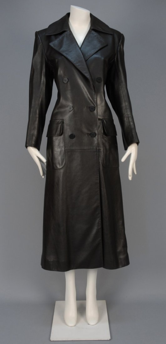 YVES SAINT LAURENT RIVE GAUCHE FULL LENGTH LEATHER: Black double breasted style having deep notched lapel and large patch pockets with flap. Labeled. B-40, Sh-18, Slv-24, L-52. Excellent.