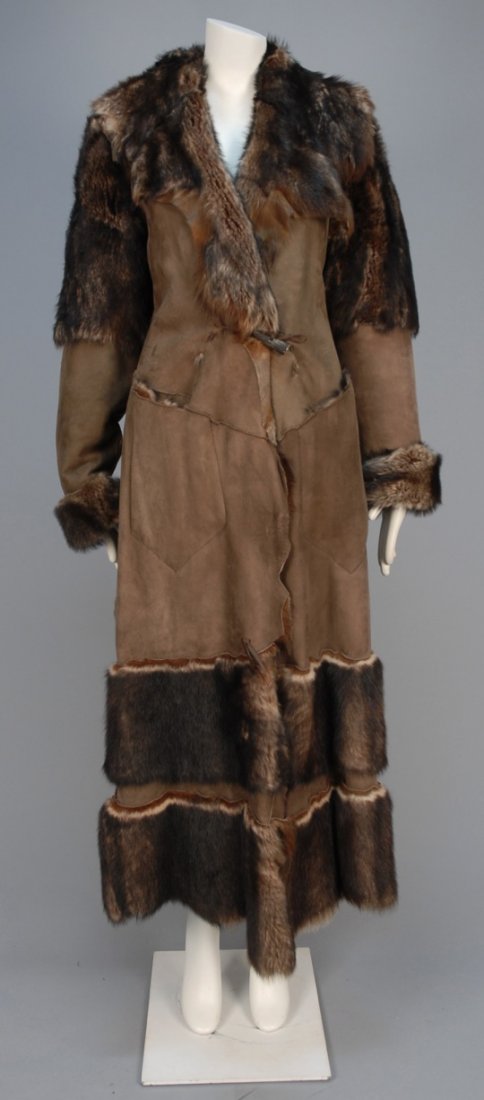 LADYS CUSTOM MADE SHEARLING COAT.: Brown suede and variegated fur pieced into an ankle length coat with fur upper sleeve, cuff and hem bands, single horn toggle closure. Unlabeled. B-40, L-56. Excellent.