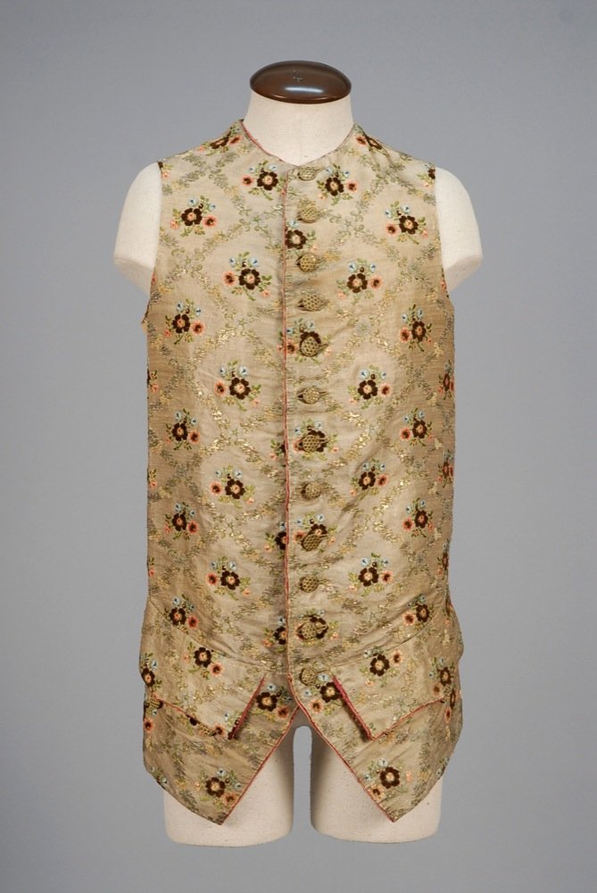 GENTS LAME and SILK BROCADE WAISTCOAT, 1750 - 1770.: GENTS LAME and SILK BROCADE WAISTCOAT, 1750 - 1770. Metallic silver having polychrome brocade floral clusters of silk and chenille within a diamond floral lattice in silver, green silk and chenille th