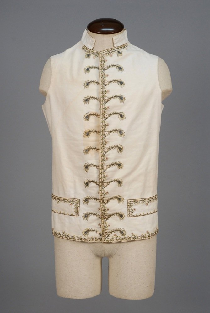 GENTS METALLIC EMBROIDERED COTTON WAISTCOAT, LATE 18th: GENTS METALLIC EMBROIDERED COTTON WAISTCOAT, LATE 18th C. White with stand collar and wide welt pocket, decorated with delicate polychrome silk and metallic gold tambour floral and front border with e