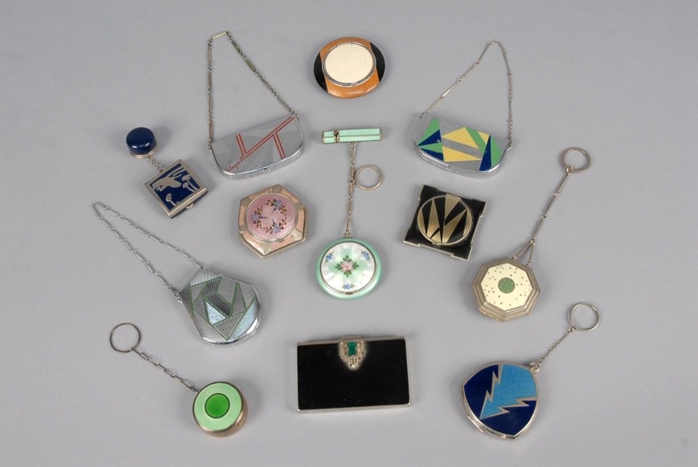 TWELVE ART DECO COMPACTS. Mostly enameled, including (1 of 2)