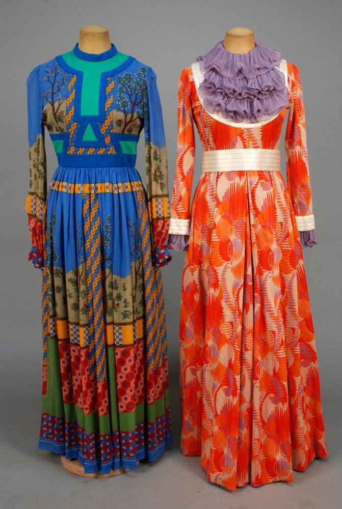 TWO RONALD AMEY PRINTED KNIT and CHIFFON MAXI DRESSES,: TWO RONALD AMEY PRINTED KNIT and CHIFFON MAXI DRESSES, 1970s. Both long sleeve: One having mosaic print with flowering trees and plants inset at neckline and waist with 2-tone wool band, button cuff w