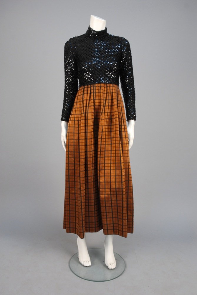 LILLIE RUBIN EVENING DRESS with SEQUINED BODICE, c.: LILLIE RUBIN EVENING DRESS with SEQUINED BODICE, c. 1970. Long sleeve mock turtleneck bodice having openwork black yarn diamond lattice covered in black sequins over black silk lining, full gathered d