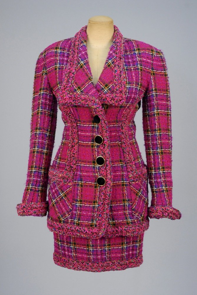 ISABELLE ALLARD PARIS WOOL SKIRT SUIT, c. 1992. Long: ISABELLE ALLARD PARIS WOOL SKIRT SUIT, c. 1992. Long princess line jacket in polychrome plaid with reflective threads on magenta ground, having long collar, patch pockets and turn-back cuff, colorful 