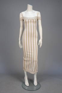 AZZEDINE ALAIA PARIS STRIPED KNIT SHEATH 1992. Stretch: AZZEDINE ALAIA PARIS STRIPED KNIT SHEATH 1992. Stretch cotton in white and khaki stripe having patterned off-the-shoulder bodice band with narrow shoulder strap and patterned hem band with back slit.