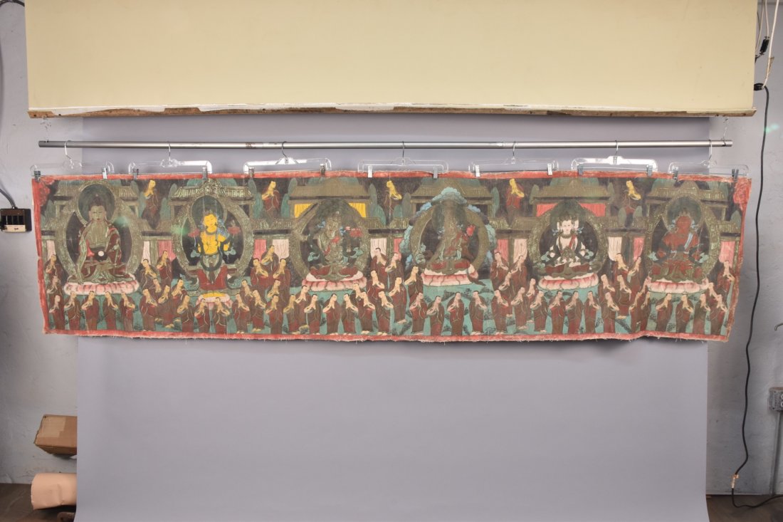 TIBETAN THANGKA, MODERN: Tempera on canvas depicting a long horizontal panel with six manifestations of Buddha and attendants. 27 x 120. Good.