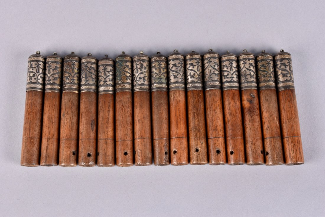SET of 15 RUSSIAN NIELLO COSSACK GAZIRI CARTRIDGES,: Georgian-Caucasian wood cylinders having silver and niello cap. L-4 1/4 x 5/8. Very good-excellent. MMA