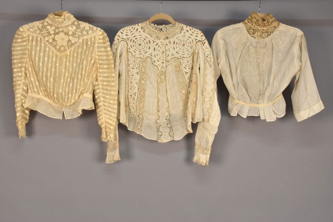 THREE CREAM LACE-TRIMMED SHIRTWAISTS, 1900 - 1910. (1 of 2)