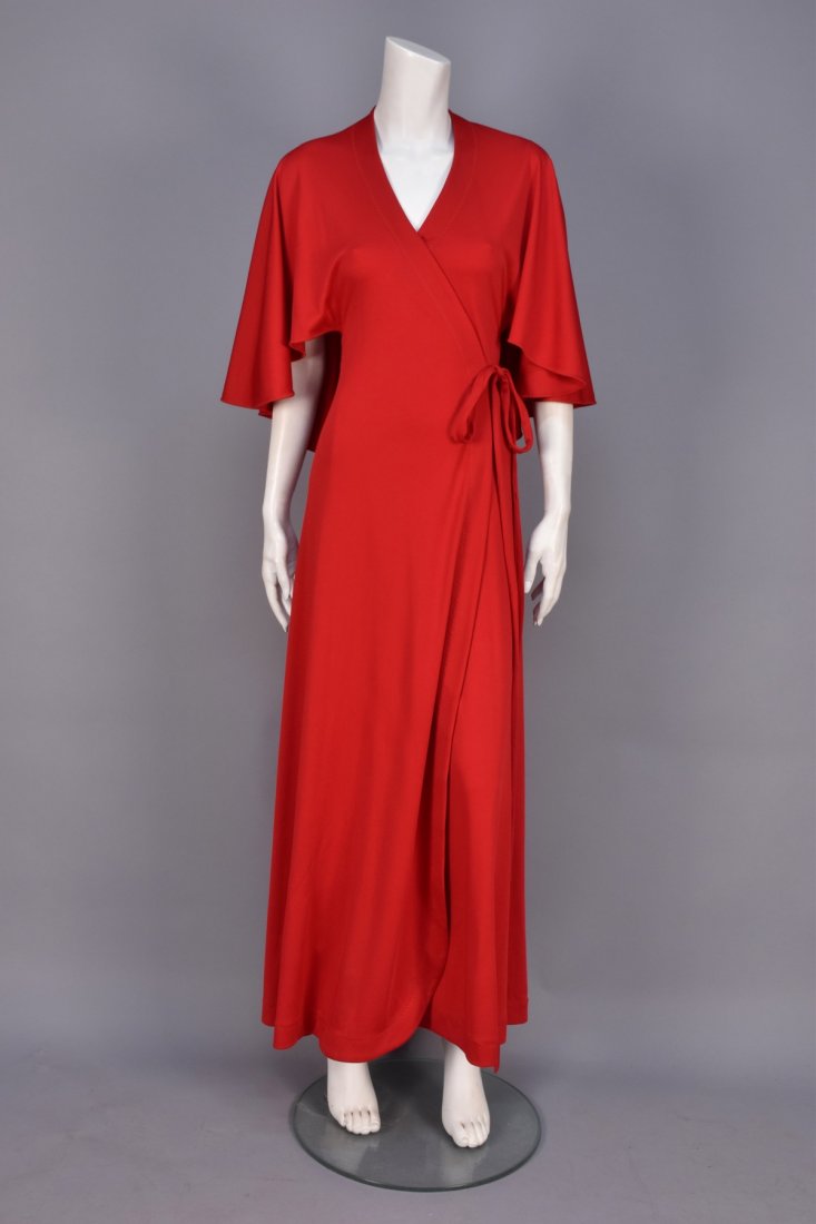 STEPHEN BURROWS JERSEY WRAP DRESS, 1970s.: Floor length red polyester with caplet bodice, traditional wrap-front styling with long self ties. Labeled. W-up to-28, L-57. (Few barely noticeable spots on lower skirt) very good.