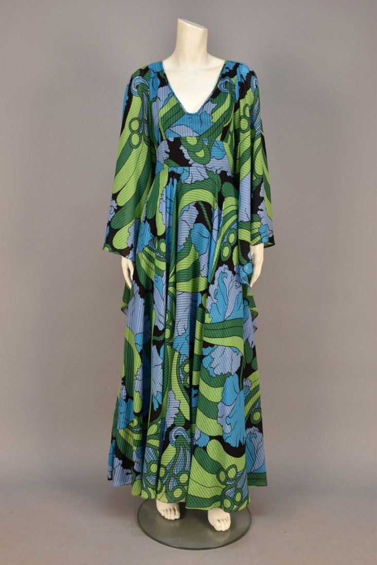 JEAN VARON PRINTED VOILE BUTTERFLY GOWN, 1970s.: Woven stripe printed with psychedelic floral in cool colors, empire bodice having low V-neck and long butterfly sleeve, wide waistband, full circle skirt, rayon lining. Labeled. B-34, W-24, L-57. Exce