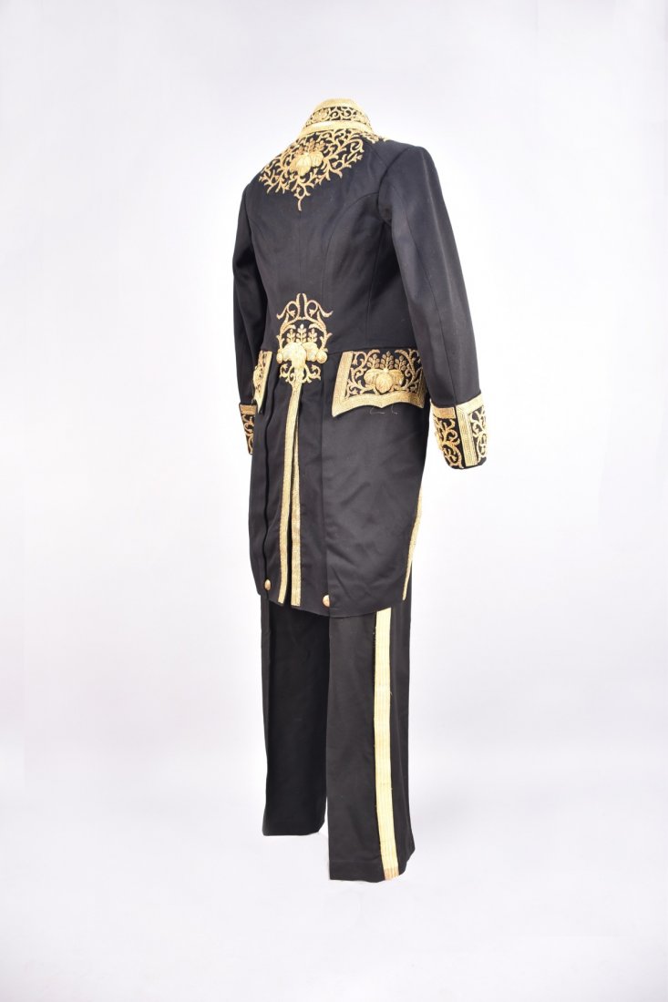 JAPANESE METALLIC EMBROIDERED COURT UNIFORM, c. 1900: Black wool broadcloth tailcoat with stand collar, deep cuff, heavily decorated with padded gold appliquÃ© and embroidery of pawlownia flowers with gold sequins and rosettes, gilt buttons having gove