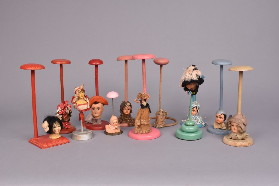 TWELVE FIGURAL HAT STANDS, 1930s (1 of 1)