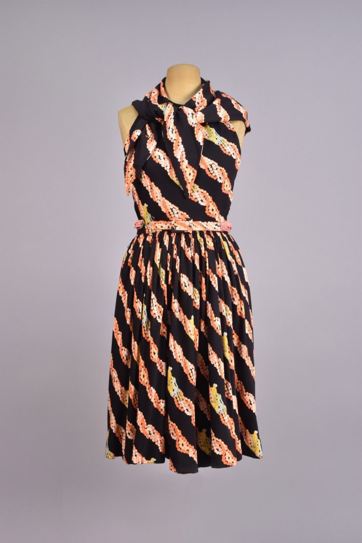 DONALD BROOKS PRINTED SILK HALTER DRESS and SCARF,: Black printed with bead necklaces in salmon, coral and gold in a diagonal stripe, backless with full gathered skirt, beaded belt with self fabric, buckle and tab, matching triangular scarf. Labeled. B