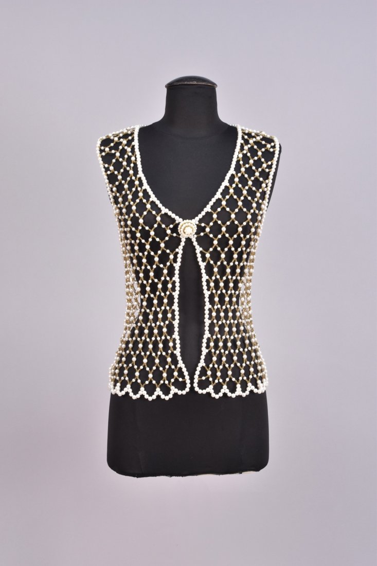 BEADED LATTICE VEST, 1960s: Diamond lattice of pearl beads joined by yellow gold beads having a single domed closure. B-34, L-23. Excellent. FIT