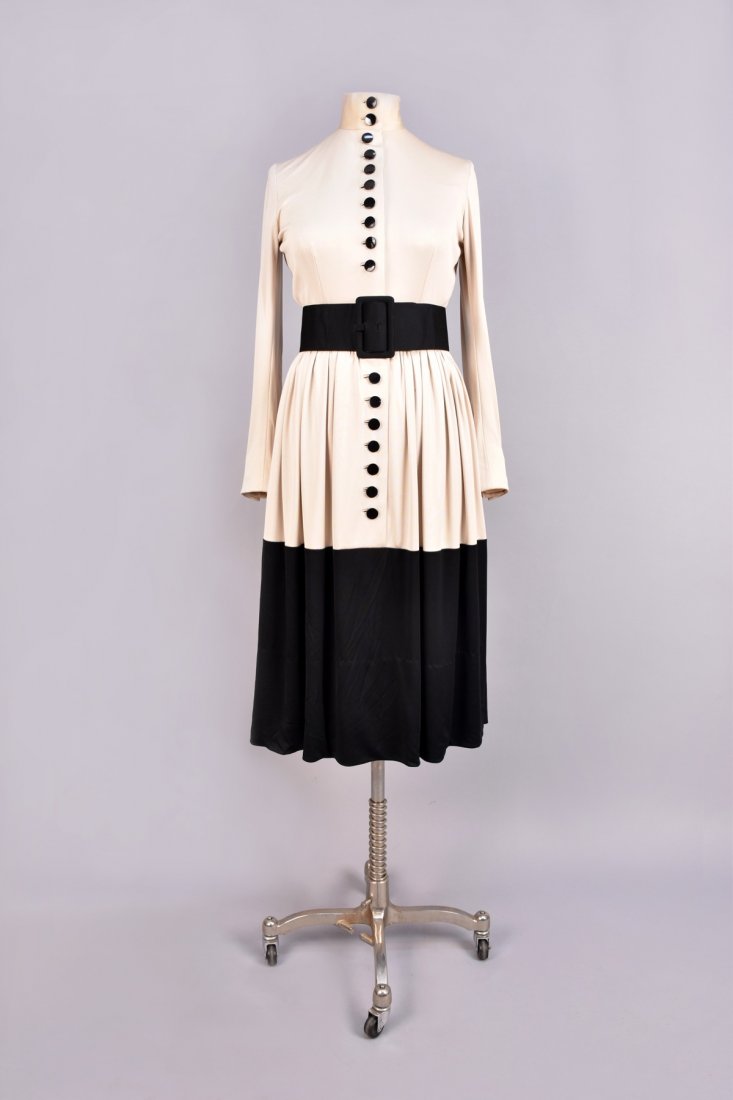 NORELL 2-TONE DAY DRESS with BUTTONS, c. 1960: Long sleeve taupe silk jersey with stand collar, set-in waist and full skirt with black buttons decorating front and lower sleeve, black lower skirt, wide belt, side-seam pockets, dress unlabeled, bel