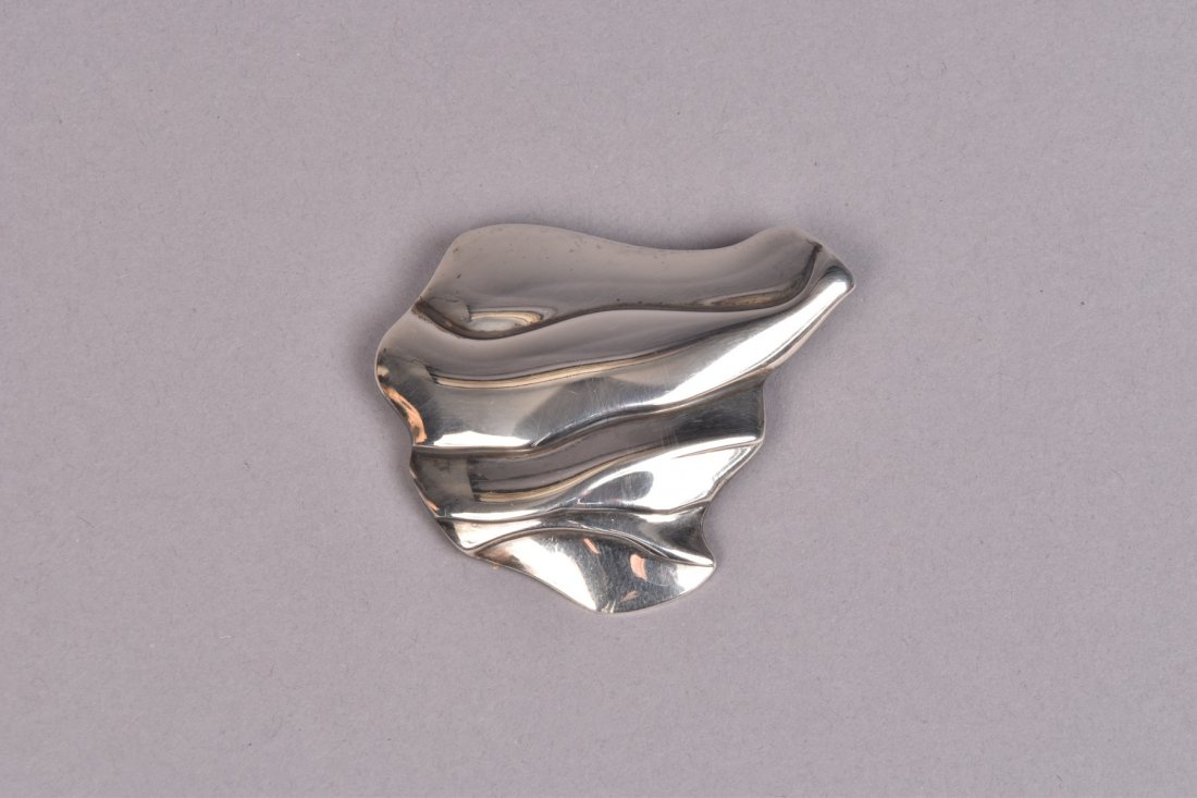 GEORG JENSEN OLE KORTZAU STERLING PIN #395 1979: Futuristic abstract form marked "925S Denmark Georg Jensen 395" 2 1/2 x 2 1/4. Excellent.