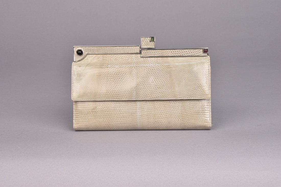JUDITH LEIBER DECO STYLE LIZARD WALLET/CLUTCH.: Grey skin having hinged silver tone frame with three cabochons, push-back clasp, divided interior with pocket, snap flap conceals credit card slots, two open and one zippered pocket, includes dust bag