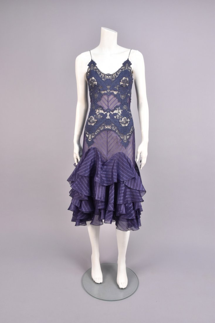 ALEXANDER McQUEEN IT'S ONLY A GAME LACE and: Sheer navy blue silk with satin stripe having spaghetti strap cotton lace long bodice, trumpet flared skirt with three undulating wide self ruffles, nude chiffon under-dress. Labeled. B-34, W-26, H-36