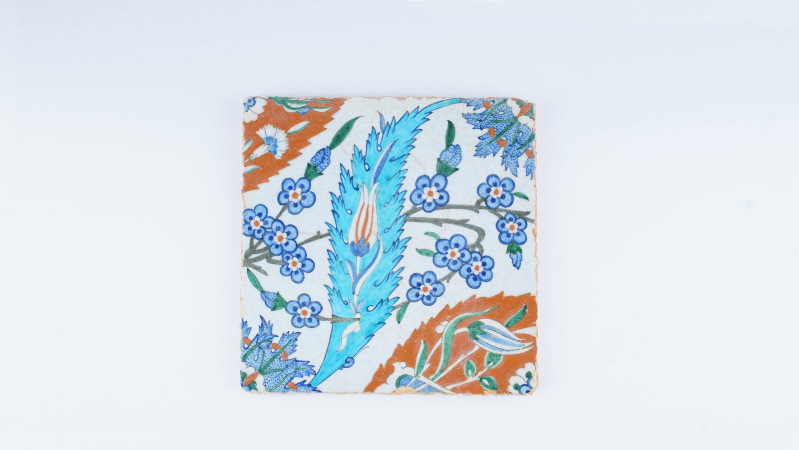 AN EXCEPTIONAL OTTOMAN IZNIK POTTERY TILE WITH A SAZ LEAF DESIGN, LATE 16TH CENTURY (CIRCA: This finely painted Iznik pottery tile, dating to the late 16th century, represents the height of Ottoman ceramic production during its classical “Golden Age.” Executed in polychrome underglaz