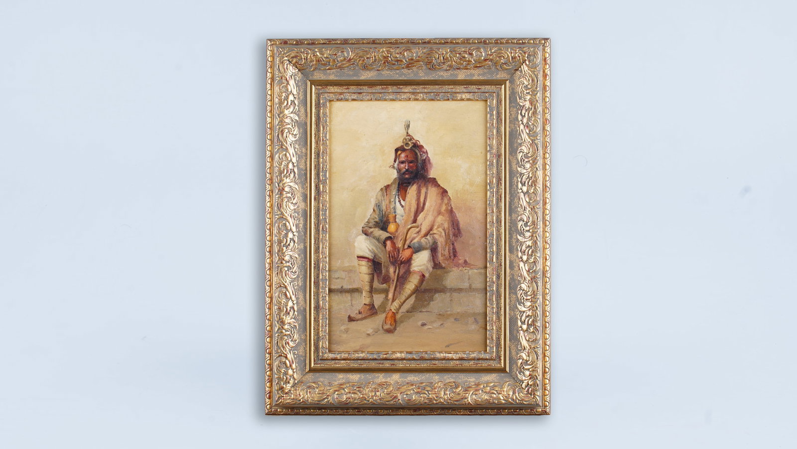 A FINE 19TH CENTURY ORIENTALIST OIL PORTRAIT ON PANEL European School: A fine 19th-century Orientalist oil painting on panel depicting a seated male figure in traditional attire, rendered with a calm and dignified presence characteristic of the Orientalist tradition. Exe