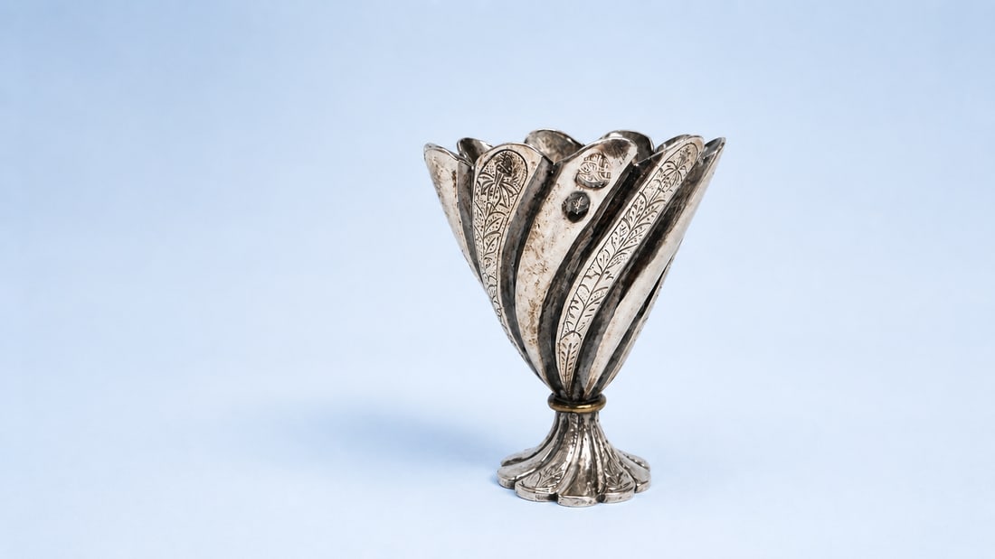 AN OTTOMAN SILVER COFFEE CUP HOLDER (ZARF) WITH TUGHRA OF SULTAN ABDÜLHAMID II, LATE 19TH CENTURY (1 of 2)