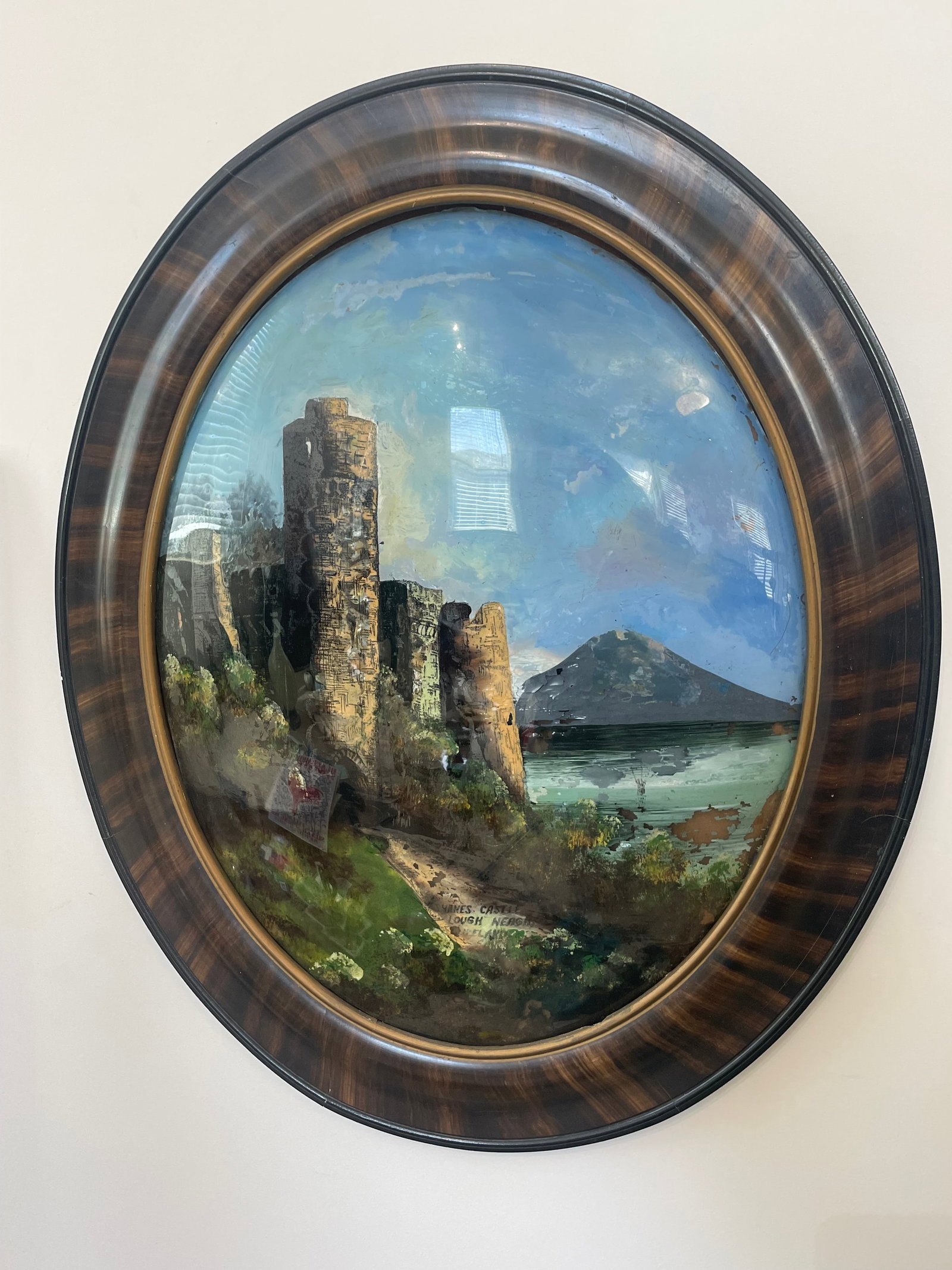 Saks Fifth Avenue Original Reverse Glass Painting Shane’s Castle Wall Decor: Absolutely beautiful reverse glass round dome painting of Shane’s Castle from Saks Fifth Avenue. Some wear to the paint is present but the piece is in overall good condition and ready to be displaye