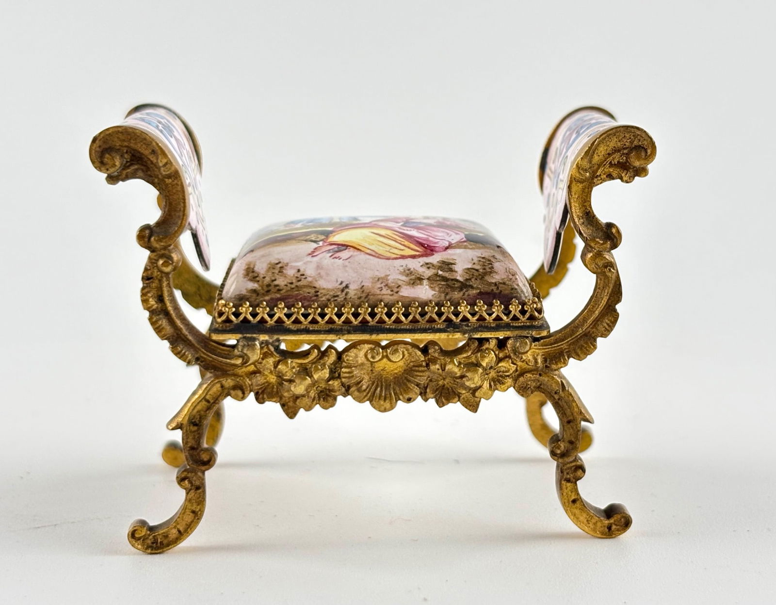 Late 19th Century Viennese Enamel Hand-Painted Piano Bench: Ornate late 19th century Viennese enamel piano bench featuring intricate hand-painted scenes and detailing. The enamel surface includes a central depiction of a pastoral scene with figures, while the
