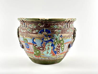 Japanese Moriage Satsuma Pottery, Taisho-Showa Era (Circa 1920-1940): Japanese moriage pottery planter featuring vibrant figural relief decoration, likely depicting courtly figures, with intricate detailing characteristic of the Taisho-Showa era (circa 1920-1940). Craft