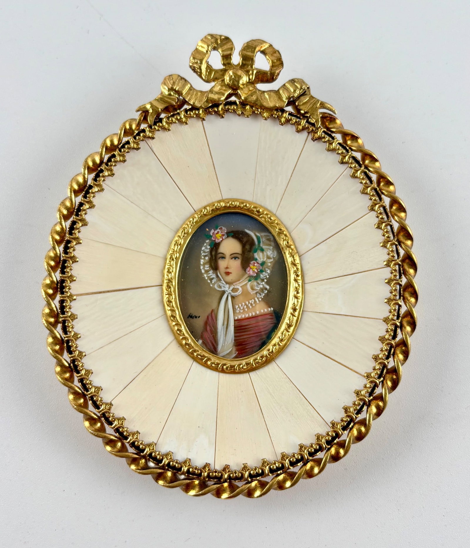 19th Century Portrait Miniature of Maria of Austria in Gilt Frame: Hand-painted 19th century portrait miniature of Maria of Austria. The portrait is enclosed in an intricately gilded oval frame, surrounded by radial segments. Signed and backed with fabric and label r
