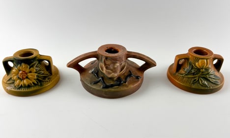 Three Roseville Pottery Candle Holders with Floral Designs