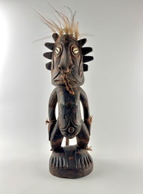 Sepik River Carved Spirit Figure with Shell Inlaid Eyes and Fiber Adornment