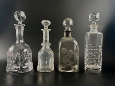 Four Vintage Crystal Decanters with Etched and Cut Designs