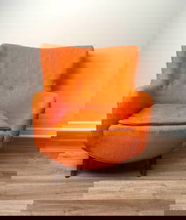 MCM Wingback Armchair Attributed to George Nelson : Mid-century modern wingback armchair attributed to George Nelson. Features vibrant orange original upholstery showing moderate wear, with visible signs of use, including fraying and loose threads. Sup