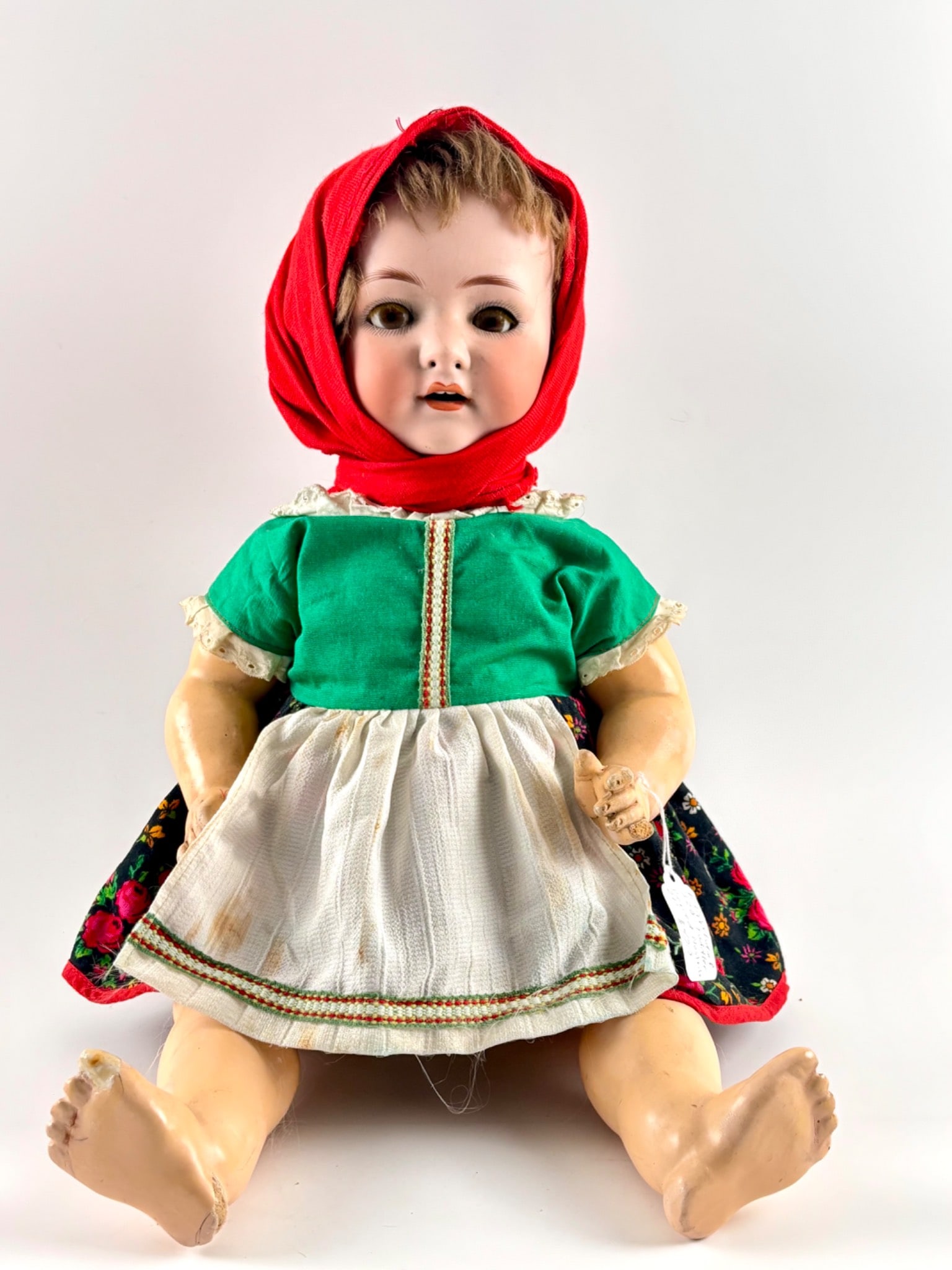 Heubach Koppelsdorf 320 German Bisque Head Toddler Doll: German bisque head toddler doll marked on the back of the neck. Features include a bisque head with pierced nostrils, sleep eyes, painted lashes, open mouth with teeth, original composition body with