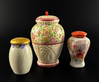 Three Ceramic Hatpin Holders with Floral and Decorative Designs