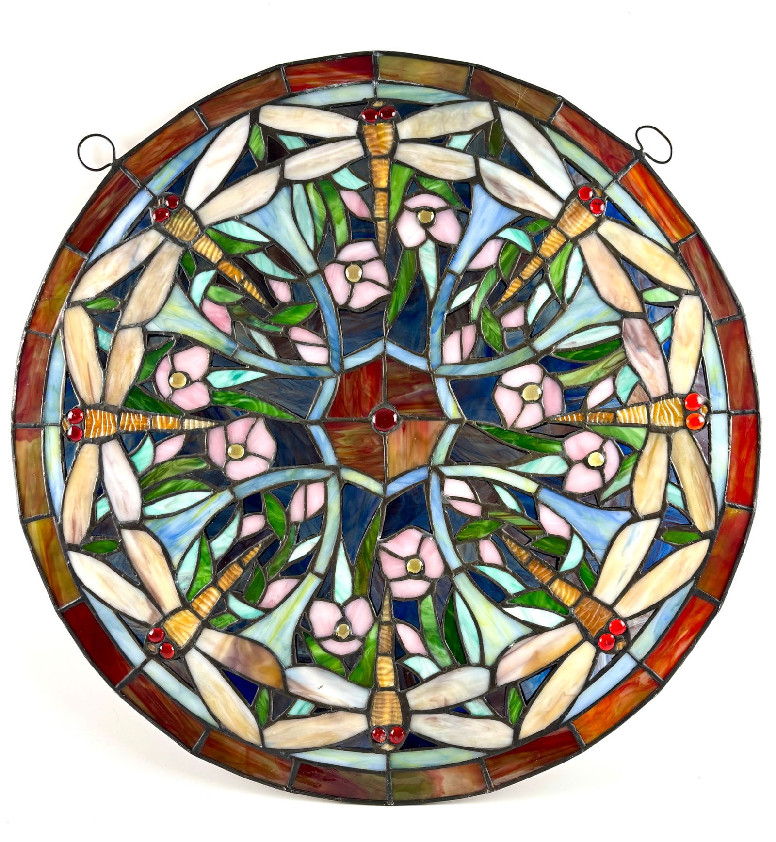 Stained Glass Round Panel Featuring Dragonfly and Floral Design: Circular stained glass panel depicting a symmetrical motif of dragonflies and pink flowers surrounded by vibrant green leaves. The panel incorporates detailed artistry with multicolored glass elements