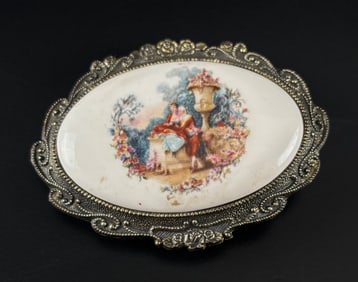 Oval Sankyo Music Box with Romantic Scene and Gilded Metal Frame