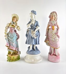 Three Bisque Porcelain Figurines Depicting Women