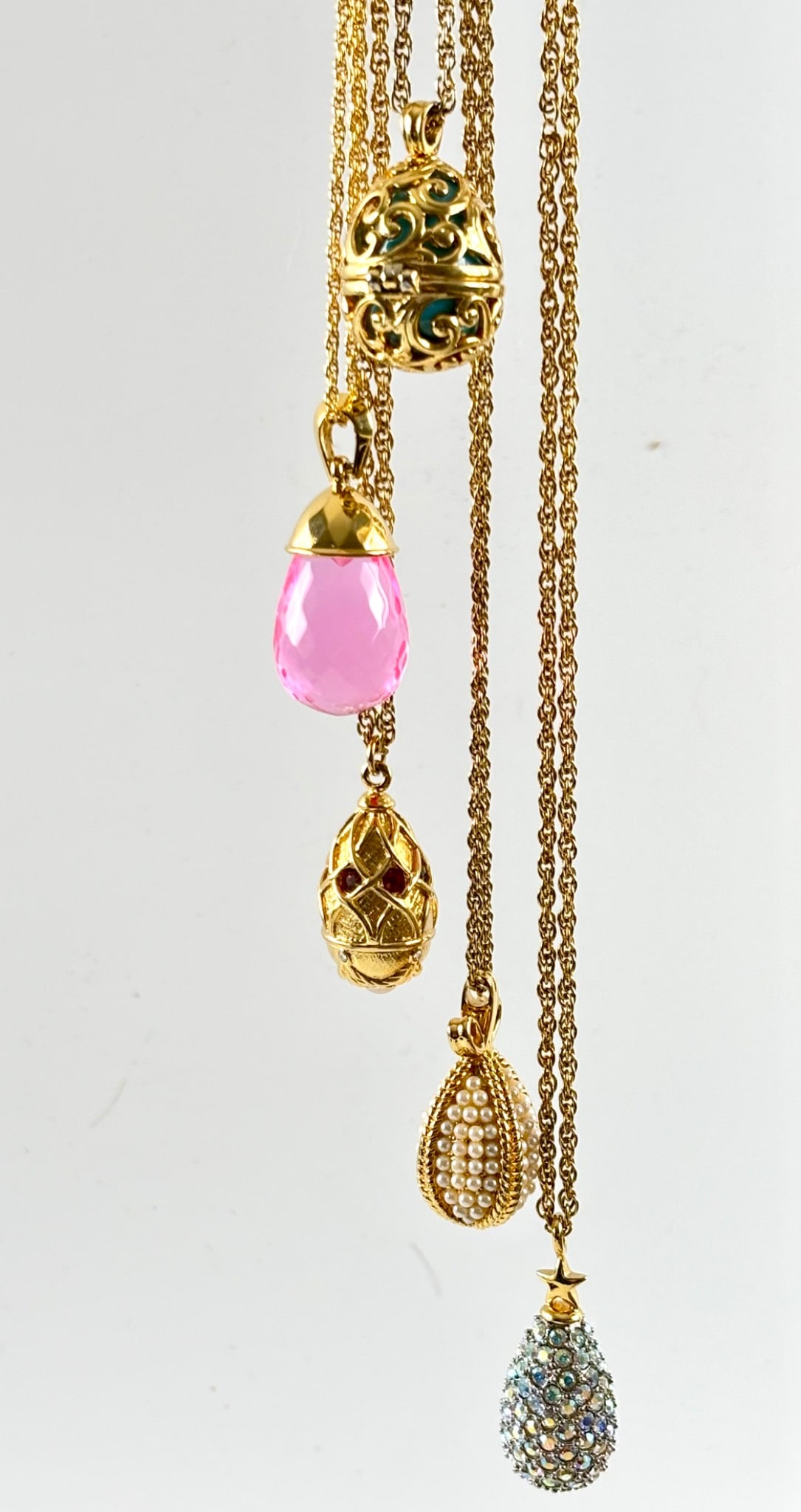Joan Rivers Egg Pendant Necklace Collection with Chains: Joan Rivers egg shaped pendant necklaces, including five gold tone chains with assorted detachable pendants. Pendants include gold tone filigree, faux pearl accented, crystal embellished, and multi co