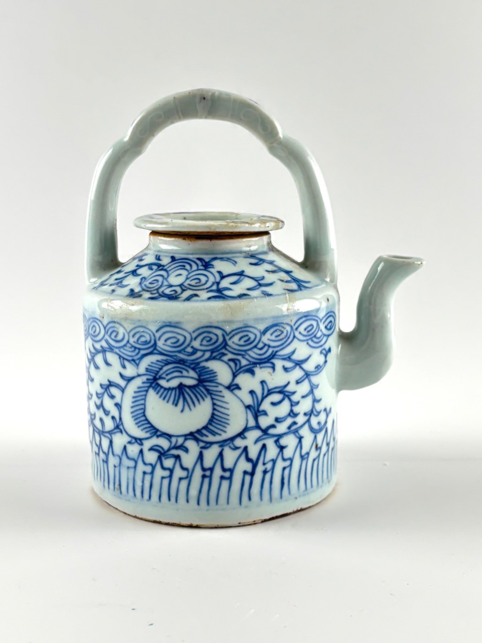 Antique Chinese Blue and White Porcelain Teapot with Lid: Antique Chinese blue and white porcelain teapot featuring intricate hand-painted floral and scrolling motifs. The design displays a central peony flower with elegant tendrils and geometric patterns. I