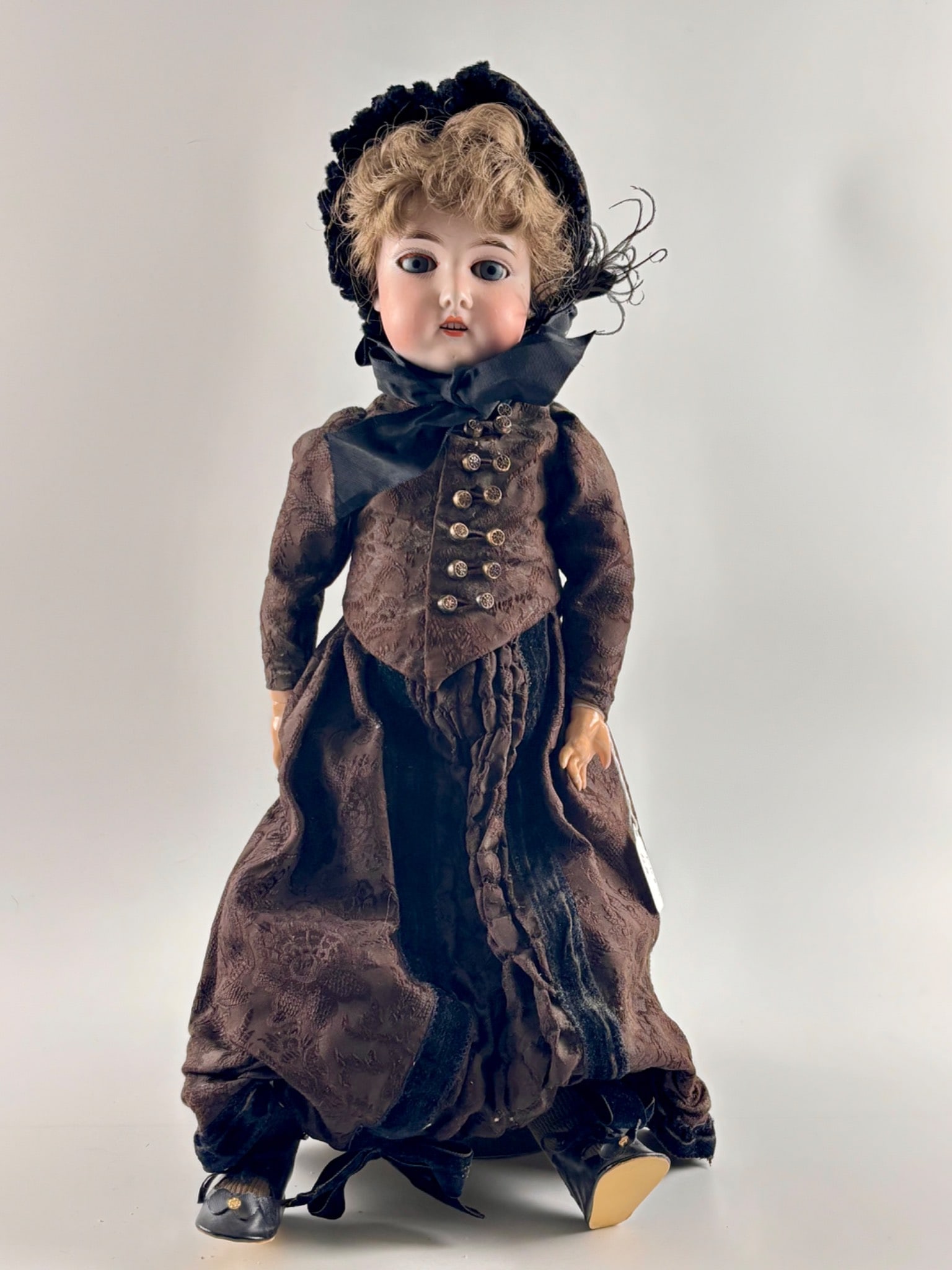 German Bisque Gebruder Kuhnlenz Doll: German bisque doll by Gebruder Kuhnlenz, circa late 19th to early 20th century. Marked Germany and 6 on the back of the head with additional maker marks. Features sleeping blue glass eyes, blonde moha