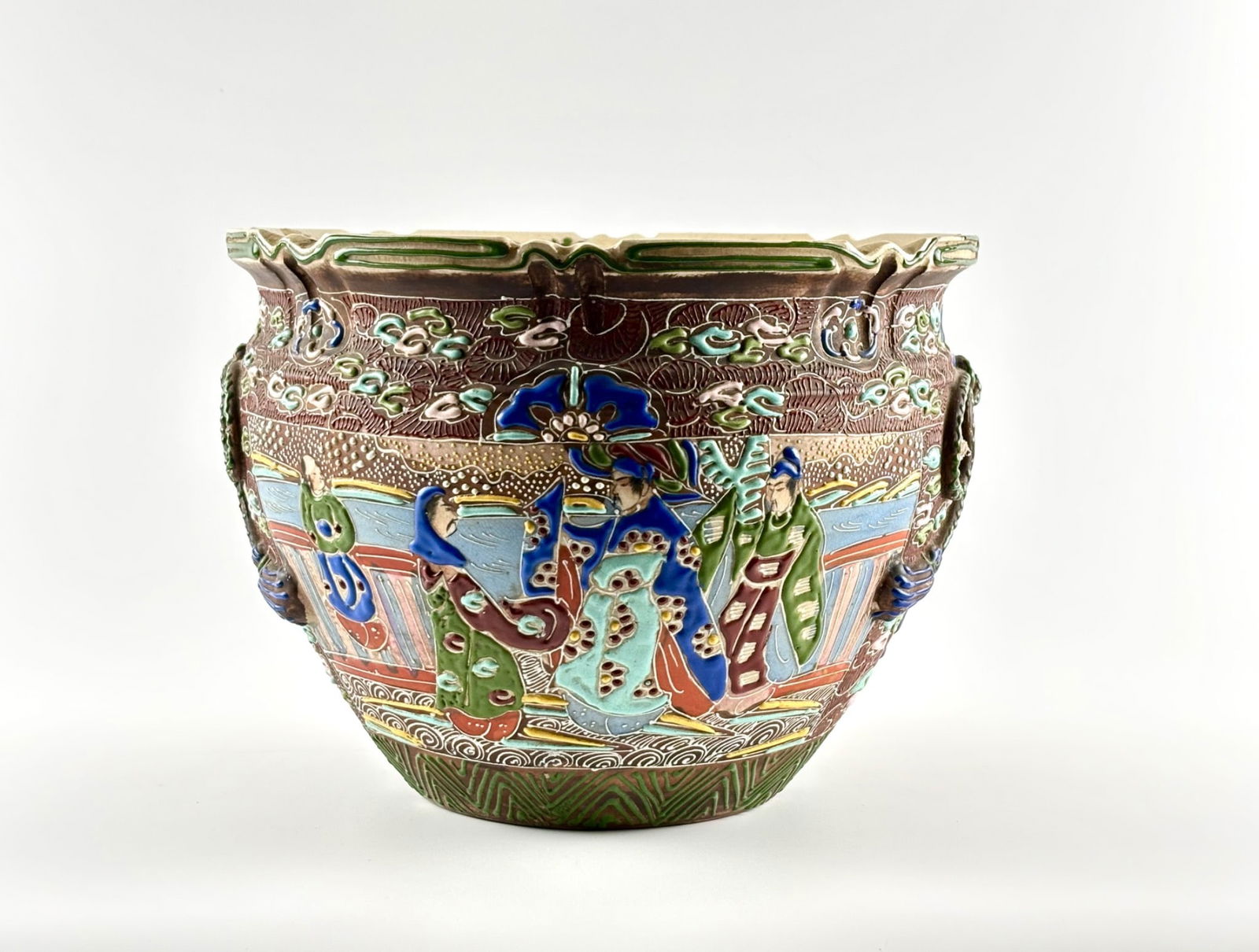 Japanese Moriage Satsuma Pottery, Taisho Showa Era: Japanese moriage pottery planter featuring vibrant figural relief decoration, likely depicting courtly figures, with intricate detailing characteristic of the Taisho-Showa era circa 1920-1940. Crafted