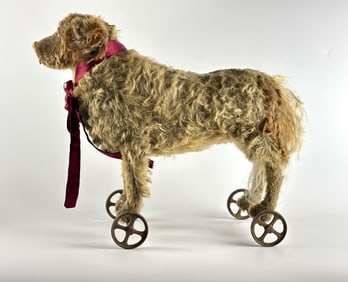 Early Steiff Pull Toy Dog with Mohair Fur and Metal Wheels